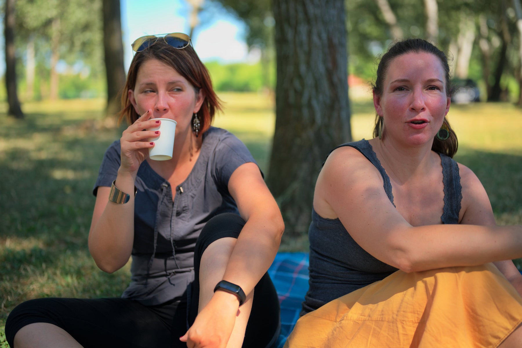  women drinking filtered water outdoor summer hydration 
